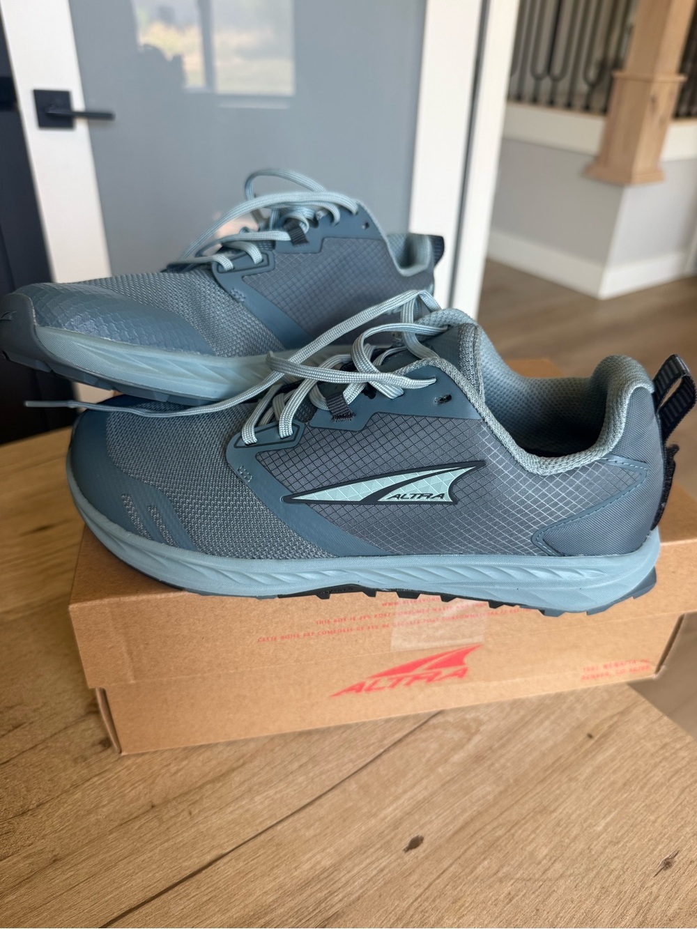 Altra Women's Trail Running shoes in slate Blue. $60